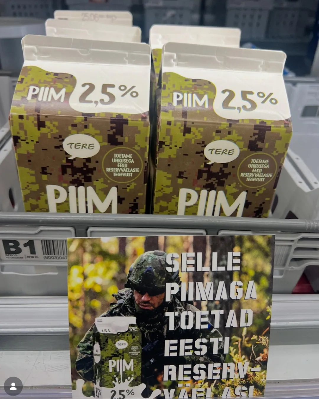 Milk cartons printed in Estonian military camouflage, supporting the reserve forces