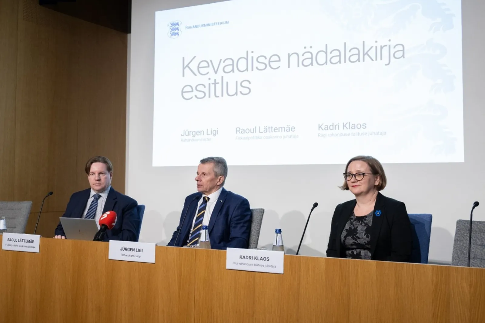 Newsletter cover: the spring economic forecast press conference recast as the spring newsletter presentation