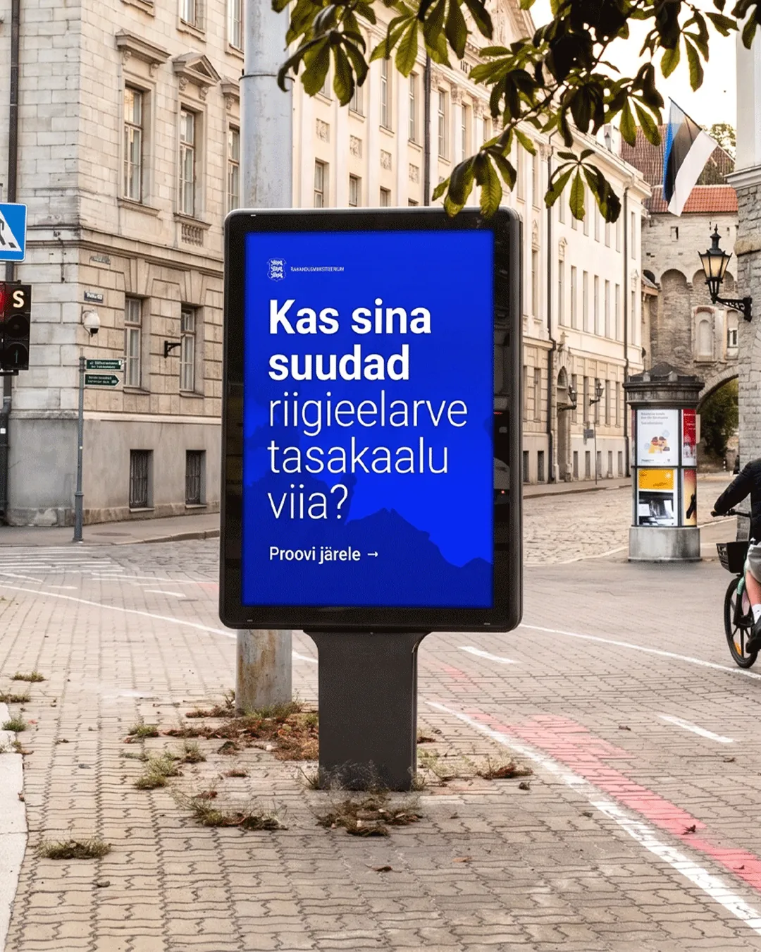 Street poster asking “Can you balance the state budget?”, promoting the budget simulator